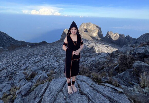 Malaysian woman dons traditional outfit at Mt Kinabalu in spirit of Hari Kaamatan